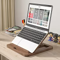 Wooden Laptop Stand On Light Desk With Green Mug Colored Pencils Figurines And Charging Phone