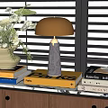 Modern Table Lamp On Stack Of Books With Floral Vase And Window Blinds