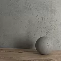 Concrete Sphere Decorative Component On Wooden Tabletop With Rough Textured Gray Wall