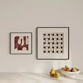 Two Abstract Paintings On Light Wall With Irregular Geometric Patterns And Pears In White Bowl 3d model