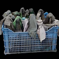 Recycled Daily Necessities In Blue Plastic Basket Filled With Old Cloths And Bottles