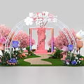Floral Art Installation with Pink Archway Cherry Blossom Trees and Colorful Tulips on Lawn Pathway