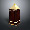 Decorative Dark Wooden Tower Like Architectural Element With Golden Trim And Pointed Top