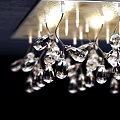 Ceiling Mounted Sparkling Crystal Chandelier With Hanging Pendants And Modern Design
