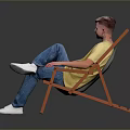 Man Sitting On Orange Folding Chair Wearing Yellow T Shirt Blue Jeans And White Shoes