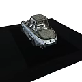 Silver Classic Sports Car Featuring Rounded Body Retro Headlights And Vintage Wheels Design