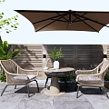 Outdoor Wicker Round Table And Chairs Set With Umbrella Plants And Wooden Fence