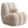 Beige Plush Single Sofa With Rounded Curved Design And Small Round Pillow