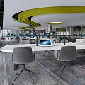 Modern Public Office Space With Workstations Computers Green Plants And Glass Partitions