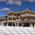 Ancient Chinese Architecture Two Story Structure With Curved Eaves And People Walking In Open Square