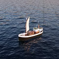 Classic Sailboat With White Sail And Brown Hull On Calm Blue Water