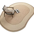 Stylish Shaped Beige Rug With Decorative Edge In Living Room With Armchair And Magazine