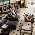 Gray Sectional Sofa with Throw Pillows Blanket Coffee Table and Bookshelves on Diamond Pattern Rug