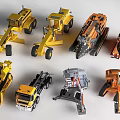 Various Utility Vehicle Model Toys Featuring Yellow And Orange Construction Types