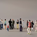 Group of People Standing Together With Different Ages Various Clothing Styles And Gray Background