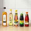 Different Types of Condiment Bottles Arranged on Kitchen Counter with White Tiles