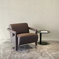 Stylish Brown Leather Armchair With Small Round Side Table On Marble Floor