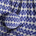 Colorful Woven Textiles Featuring Geometric Patterns And Vibrant Diamond Stripe Designs