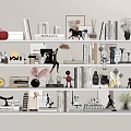 Stylish Decorative Ornaments Combination On Shelves With Books Figurines Plants And Frames