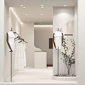 Minimalist Modern Clothing Store Mannequins In White Dresses Wooden Hangers Soft Lighting And Green Plant