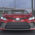 Red Toyota Sedan Modern Exterior Design With LED Headlights And Alloy Wheels