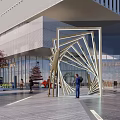 Modern Commercial Complex With Glass Facade And Metal Structure Surrounded By Trees And Pedestrians