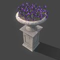 Purple Flowering Plants In Decorative Stone Planter On Pedestal Base