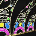 Curved Event Entrance Arch With Colorful Floral Decor And Illuminated Design