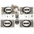 Stylish Tableware Set Featuring White Plates Black Napkins Silver Cutlery Wine Glasses And Candle Holders