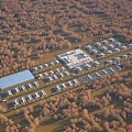 Aerial View Planning of Neatly Arranged Buildings with Surrounding Trees and Facility Layout
