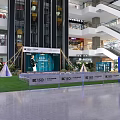 Floral Display in Shopping Mall Indoor Space With ISO Signage Greenery Tents and Fencing