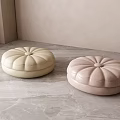 Cream And Light Pink Pumpkin Shaped Poufs On Marble Floor