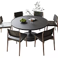 Modern Round Wooden Table And Six Chairs Set With Fruit Bowl And Green Plant