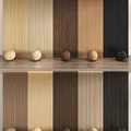 Various Wooden Wall Panels With Different Wood Tones And Decorative Balls On Display Shelf