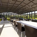 Glass Enclosed Lounge Area With Open Design Tables And Comfortable Chairs