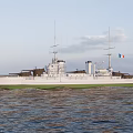 Vintage White And Green Warship Sailing At Sea With Masts Smokestacks And Gun Turrets