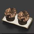 Two Chocolate Muffins Topped With Chocolate Crumbles On White Tray