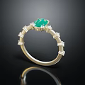 Elegant Gold Band Ring With Central Green Gemstone And Geometric Details