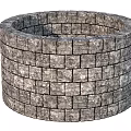 Circular Stacked Stone Brick Structure With Textured Gray Masonry Design