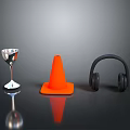 Everyday Living Items Featuring Silver Cocktail Glass Orange Traffic Cone And Black Headphones