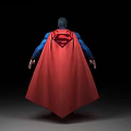 Man In Blue Superhero Bodysuit With Red Cape And Chest Logo Standing Pose