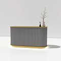 Modern Reception Desk With Ribbed Grey Panel And Golden Base Decorated With Vase And Twigs