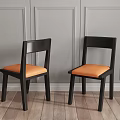 Modern Dining Table Set with Black Tabletop Orange Chairs Vase Flowers and Wall Art in Interior
