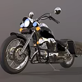 Classic Black Cruiser Motorcycle With Chrome Headlights Side Saddlebags And Shiny Wheels