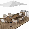Stylish Outdoor Table Setup On Wooden Deck With White Umbrella Chairs And Kitchen Unit