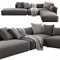 Comfortable Modern L Shaped Sectional Sofa with Gray Pillows and Throw Blanket
