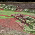 Natural Outdoor Scene With Stone Troughs Bicycle Gravel Ground And Distant Water