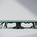 Artistic Outdoor Table With Light Blue Textured Tabletop And Root Like Green Legs