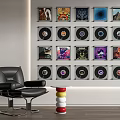 Neatly Arranged Digital Smartphones Wall Display With Accessories Near Leather Chair