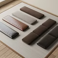 Various Colored Textured Long Cushions Neatly Arranged on Light Mat with Wooden Floor
